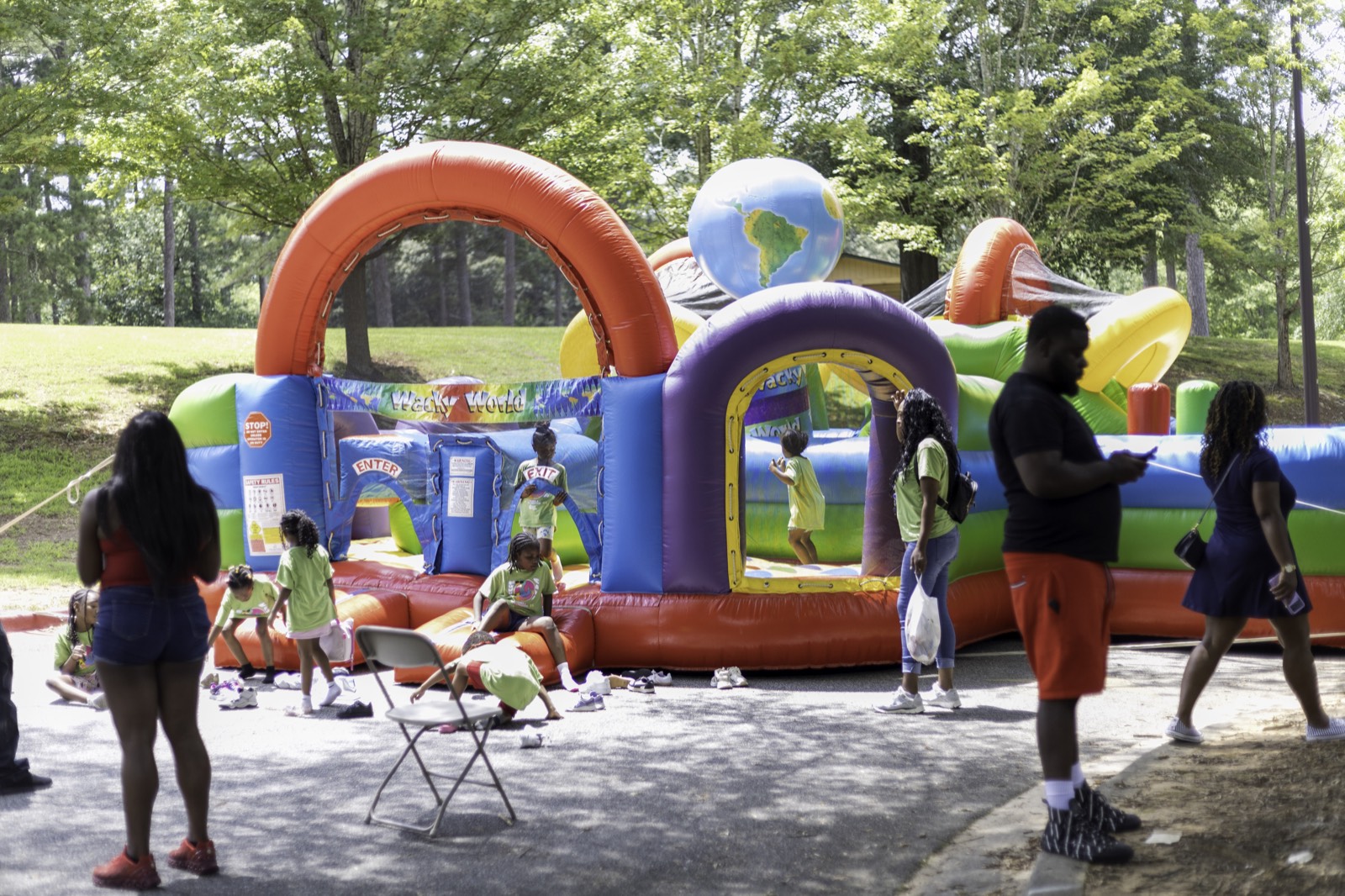 Kids playing on the inflatable obstacle course at Turbo Day 2025