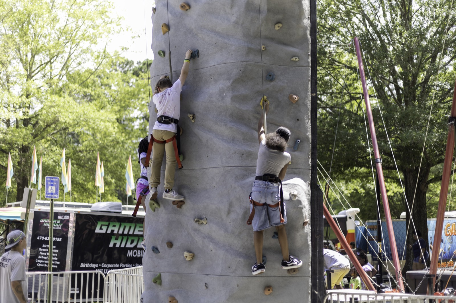 Kids climbing the rock wall at Turbo Day 2025