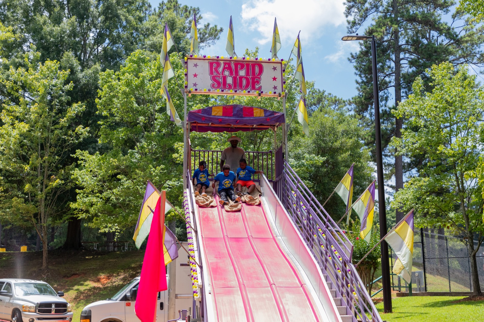 Kids racing down the Rapid Slide at Turbo Day