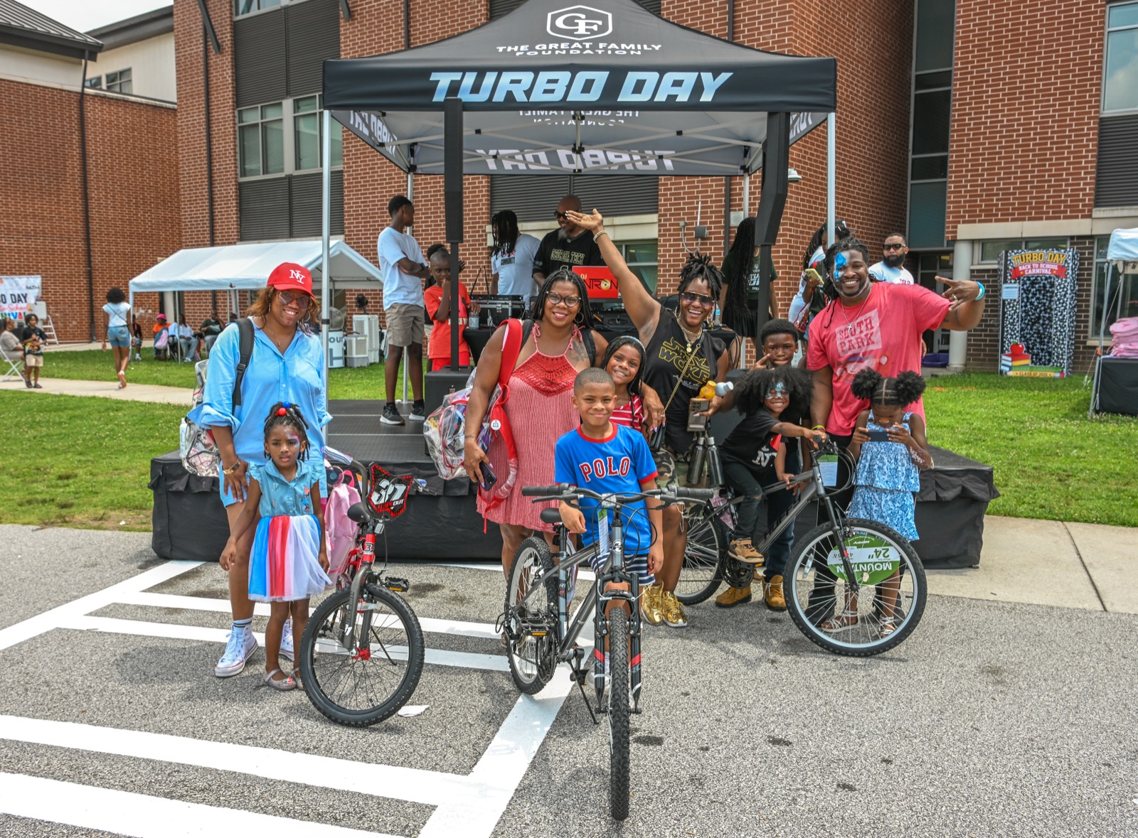 Families showing off their new bikes at Turbo Day 2026