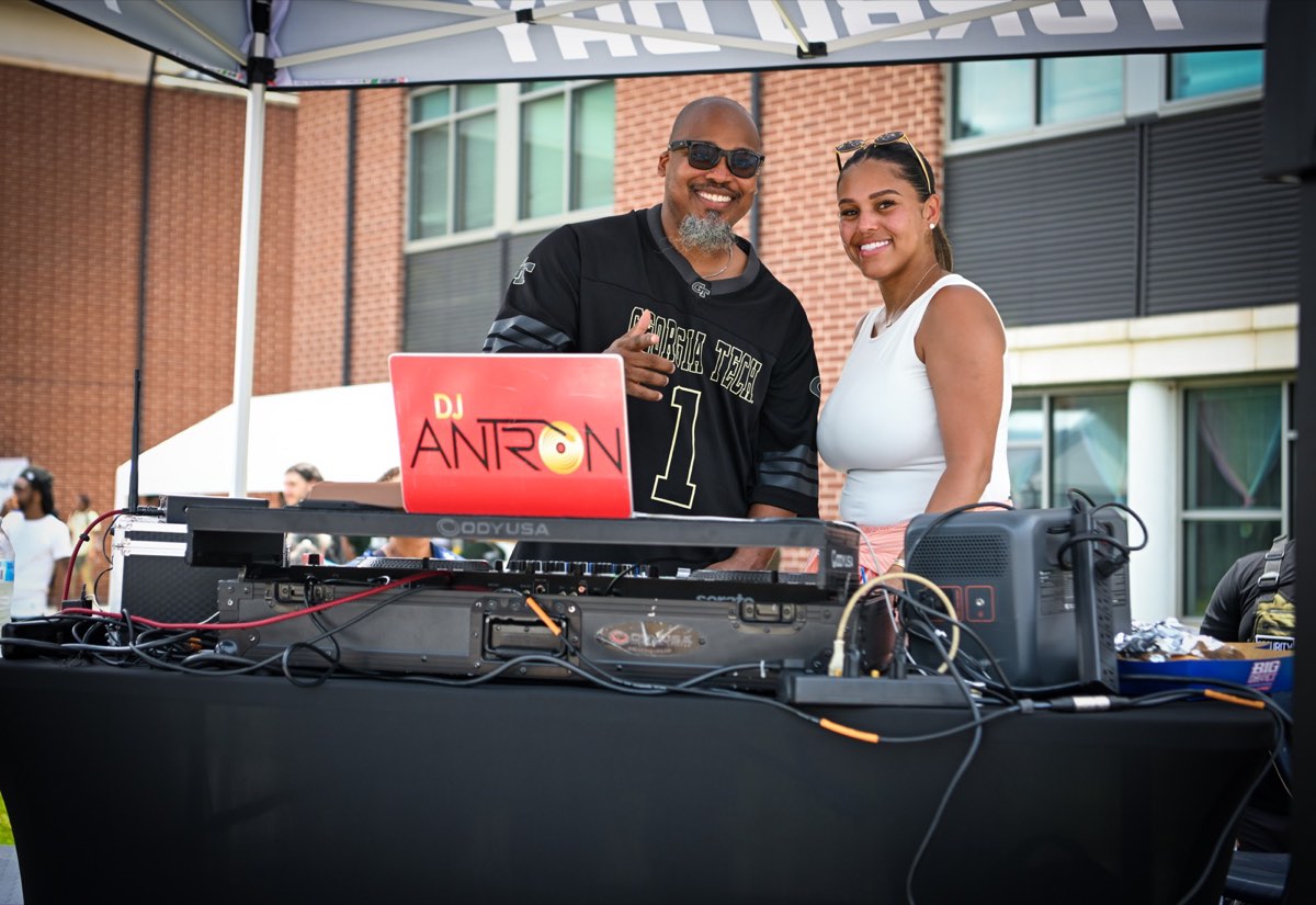DJ Antron all smiles at the DJ booth at Turbo Day 2026