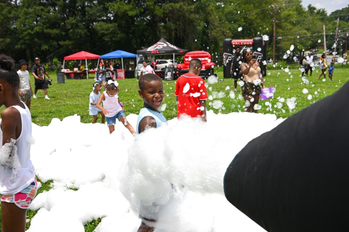 Kids playing in foam from the foam cannon at Turbo Day 2026
