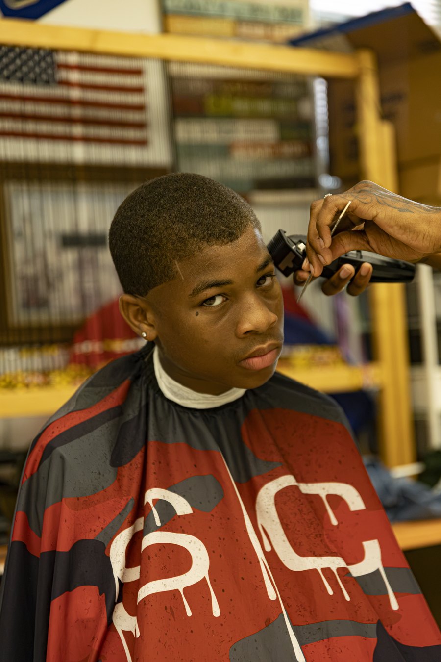 A young man getting a fresh haircut from a barber at Turbo Day 2026