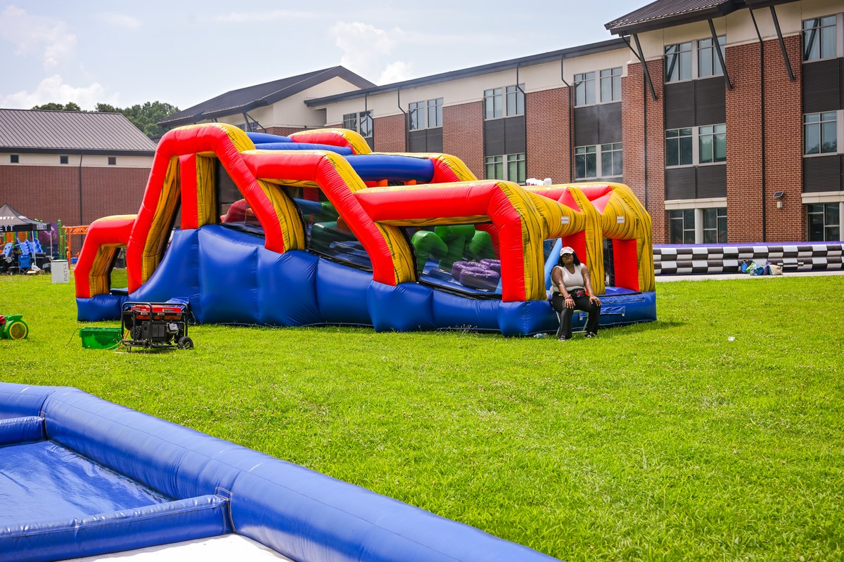 A large inflatable obstacle course set up on the field at Turbo Day 2026