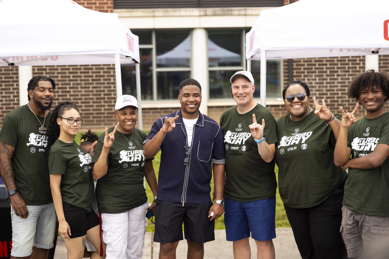 Turbo with staff and volunteers in Turbo Day shirts at Turbo Day 2026